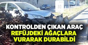 Kontrolden çıkan araç refüjdeki ağaçlara vurarak durabildi