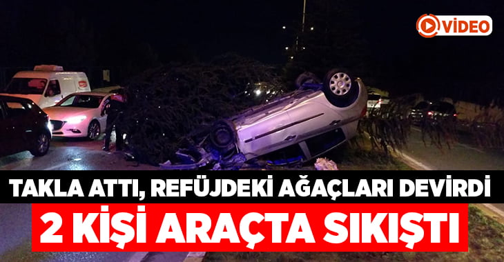 Takla atan otomobil refüjdeki ağaçlar sayesinde durabildi: 2 yaralı