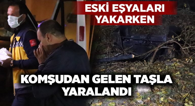 Eski eşyaları yakan adam, komşudan gelen taşla yaralandı