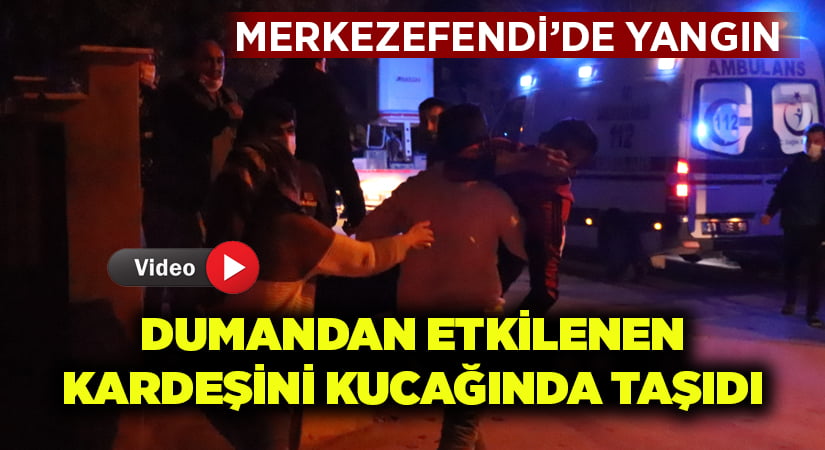 Merkezefendi’de yangın.. Dumandan etkilenen kardeşini kucağında ambulansa taşıdı