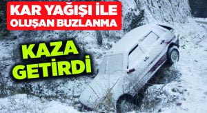 Buzlanan yolda otomobil şarampole uçtu