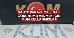 Sahte paraya orijinal hissi vermek için mum kullanmışlar